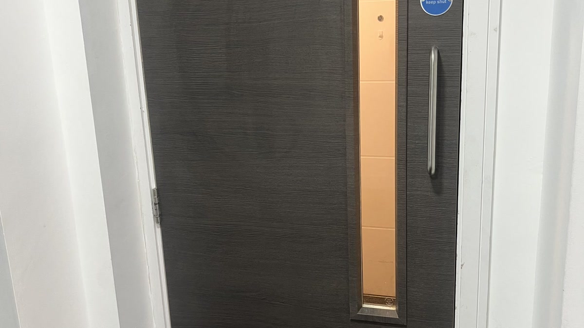 Flat entrance fire door installed by Lyons