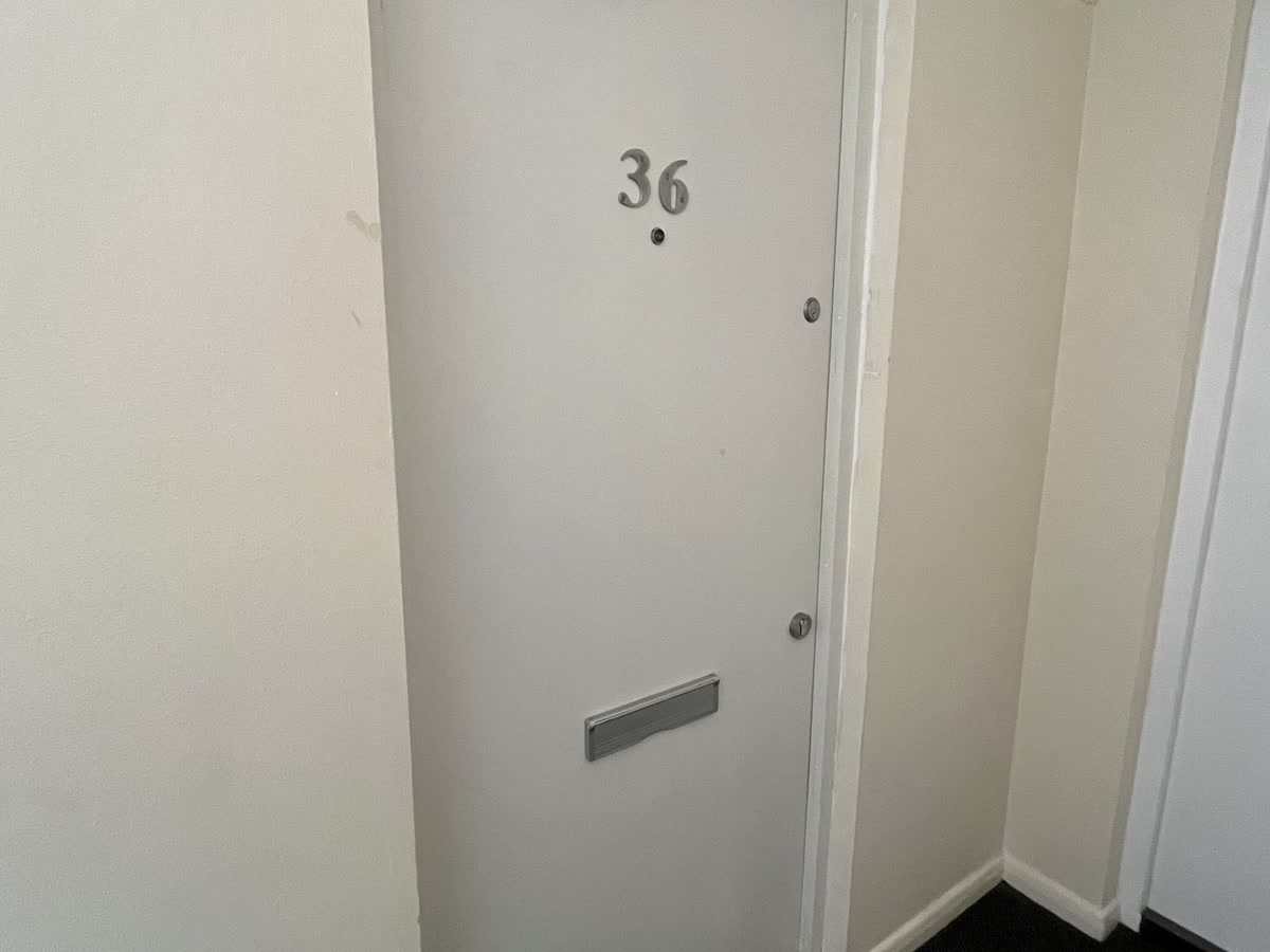 Certified flat entrance fire door numbered 36