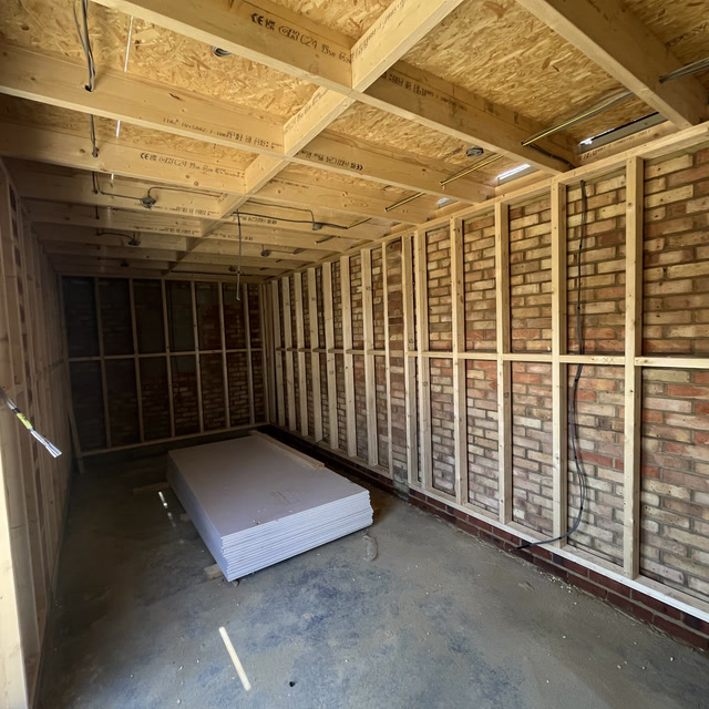 Timber stud partitioning and wall framing ready for plasterboard